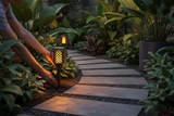 Installing 3in1 Solar Flame Torch Light as ground stake along garden pathway