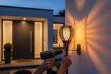Mounting 3in1 Solar Flame Torch Light on exterior wall near front door
