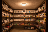 Solar ceiling light installed in a shop illuminating shelves at night