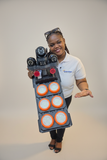 Presenter holding the solar street light with six LED modules and three PTZ camera lenses against a clean studio background